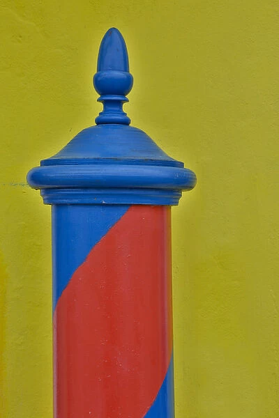Red & Blue painted and stripped pole with Yellow Home as backdrop, Burano Italy