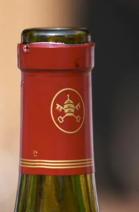 Framed Print : Red chateauneuf bottle with the logo symbol of the appellation, the popes hat and keys