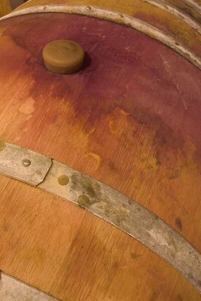 Red wine stain around cork of French oak barrel at Sokol Blosser Winery near Dundee, Oregon, USA
