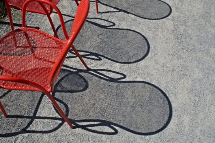 Framed Print : Red wire chairs shadows on concrete Framed Print : Red wire chairs shadows on concrete