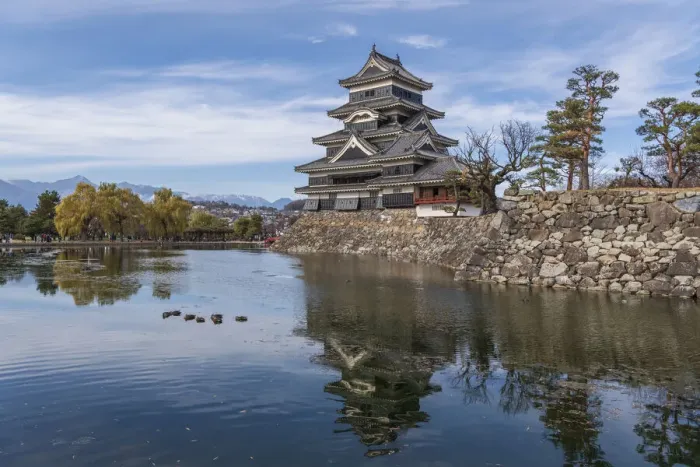 Framed Print : The reflection of the Matsumoto Castle and the castle against the mountain backdrop in