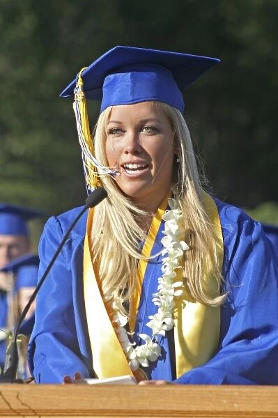 Released high school female graduate valedictorian speaks at outdoor ceremony Mt
