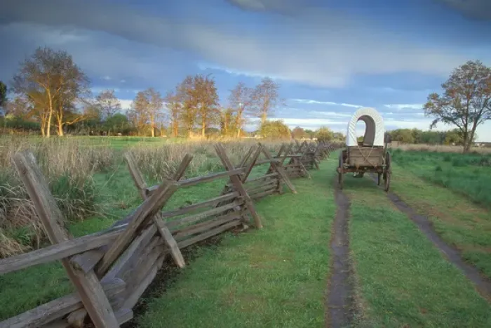 Framed Print : A replica wagon at sunrise along the Original Oregon Trail found at Whitman Mission