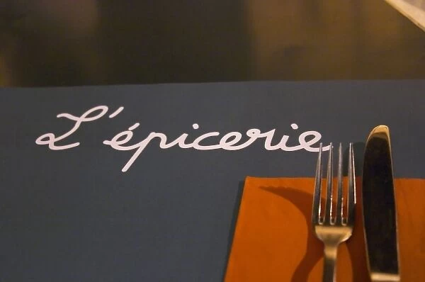 The restaurant l Epicerie in Avignon. Detail of table mat and knife fork and napkin