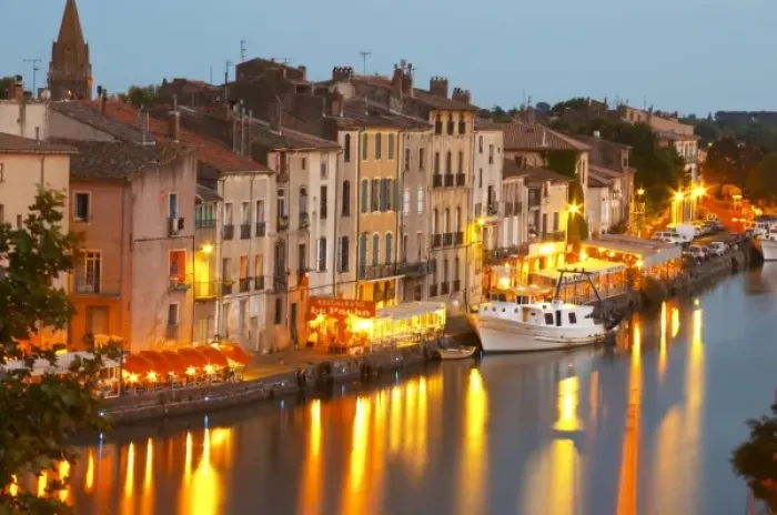 Framed Print : Restaurants along the l Herault river. L Herault river. A fishing boat. Agde town Framed Print : Restaurants along the l Herault river. L Herault river. A fishing boat. Agde town