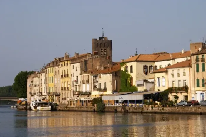 Framed Print : Restaurants along the l Herault river. L Herault river. Agde town. Languedoc