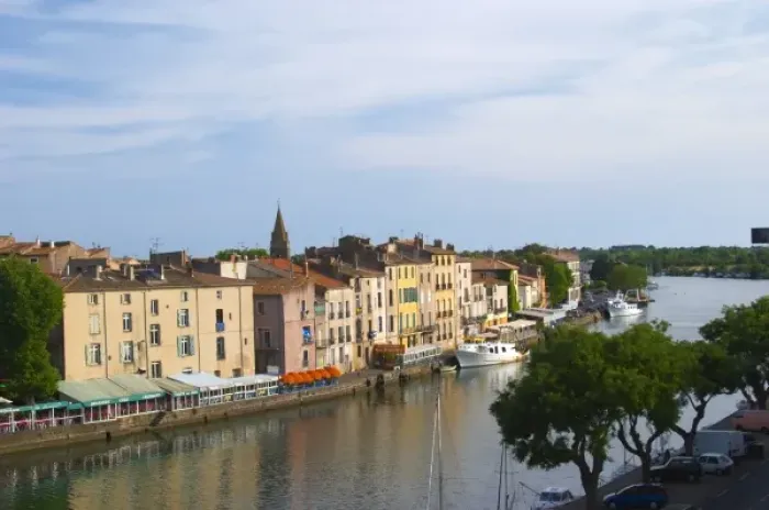 Framed Print : Restaurants along the l Herault river. L Herault river. Agde town. Languedoc