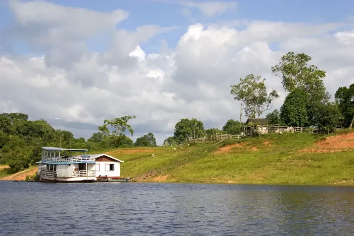 Framed Print : River boat and house on the Arasa River in the Amazon jungle near Manaus, Brazil Framed Print : River boat and house on the Arasa River in the Amazon jungle near Manaus, Brazil