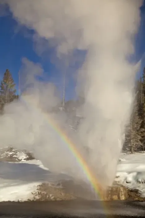 Framed Print : Riverside Geyser erupts along the Firehole River on a nice sunny winter day in Yellowstone