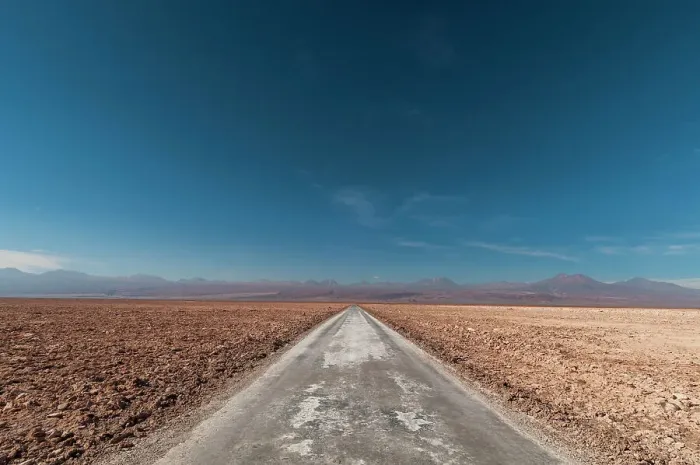 Framed Print : An empty road through a salt flat in the Salar de Atacama. Salar de Atacama, Atacama Desert, Antofagasta Region, Chile