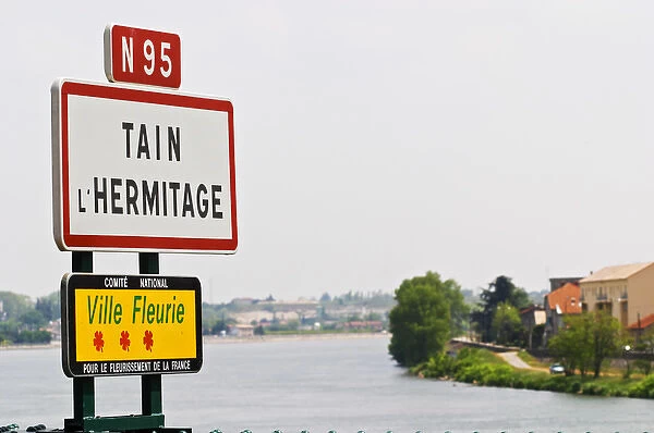 A road sign at the entrance to the town Tain l Hermitage. Tain laaHermitage