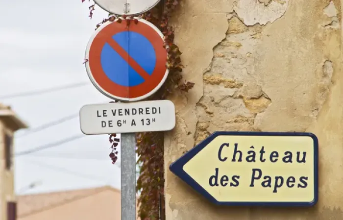 Framed Print : Road sign showing the way to the ruins of the chateu Popes old summer palace