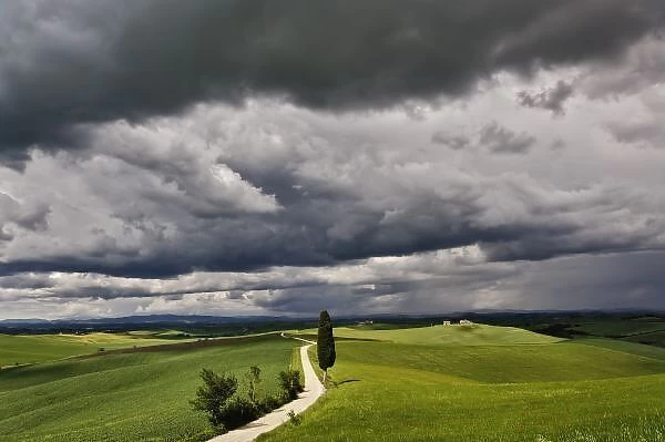 Road and storm clouds, rural Tuscany region, Itay