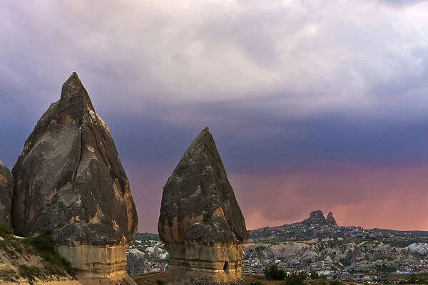 Rock formation and village in Goreme at sunset, Cappadocia (UNESCO World Heritage Site)