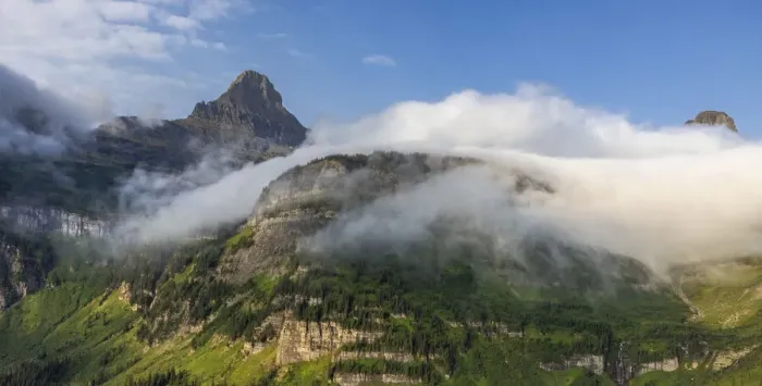 Framed Print : Rolling fog clouds with Heavy Runner and Reynold Mountains at Logan Pass in Glacier National Park, USA
