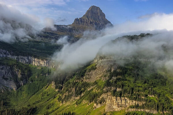 Rolling fog clouds with Reynolds Mountains at Logan Pass in Glacier National Park, USA