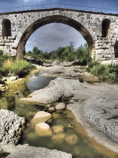 This is a Roman bridge, called Pont Julien near the town of Lacoste