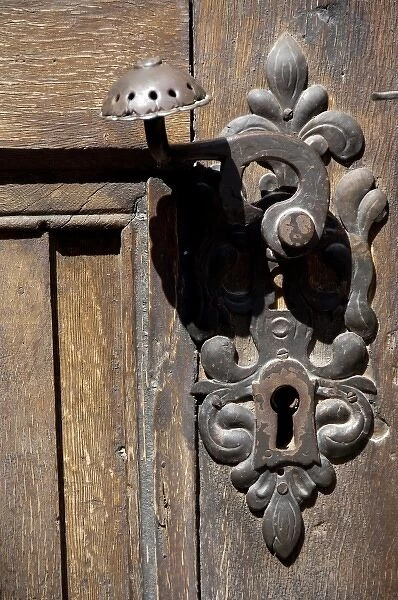 Romania, Transylvania, Brasov. The Black Church, detail of wooden door with iron latch