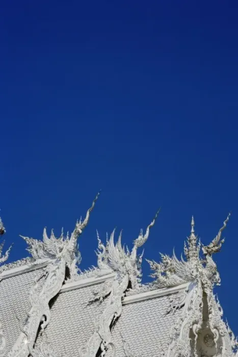 Framed Print : Rooftop architectural details of the new all white temple of Wat Rong Khun in Tambon Framed Print : Rooftop architectural details of the new all white temple of Wat Rong Khun in Tambon