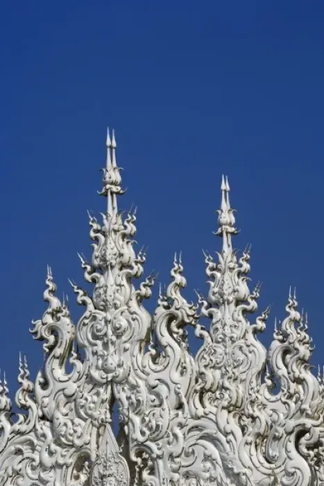 Framed Print : Rooftop architectural details of the new all white temple of Wat Rong Khun in Tambon