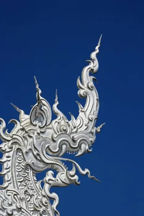 Framed Print : Rooftop architectural detail of dragon head on the new all white temple of Wat Rong Framed Print : Rooftop architectural detail of dragon head on the new all white temple of Wat Rong