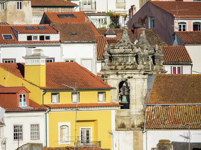 Framed Print : Rooftops of the town of Coimbra and the old bell tower of St. Bartholomew church