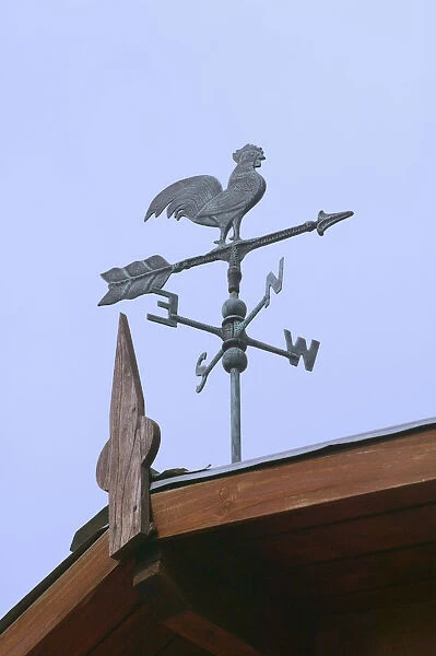 Rooster windwane on top of house, El Calafate, Argentina