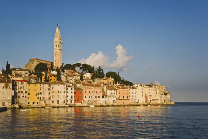 Framed Print : Rovigno skyline and Cathedral of St. Euphemia reflected on Adriatic Sea at sunrise
