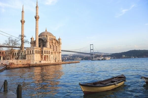 Row boat and Buyuk Mecidiye Camii in Ortakoy, Bosphorus, Istanbul, Turkey