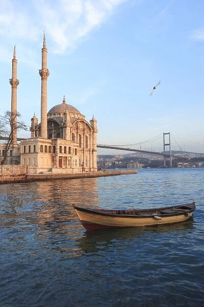 Row boat and Buyuk Mecidiye Camii in Ortakoy, Bosphorus, Istanbul, Turkey