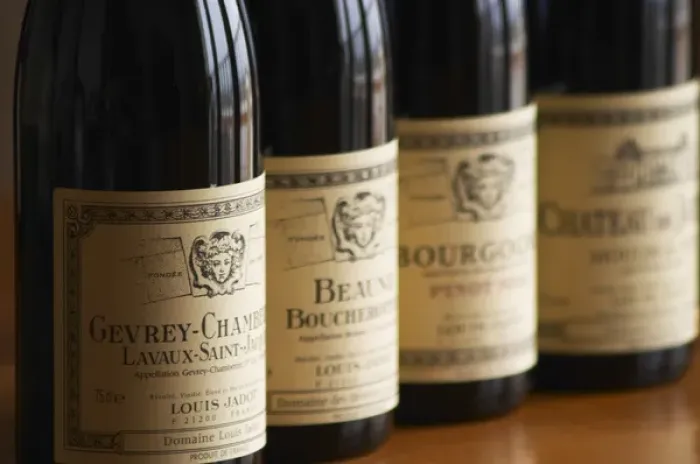 Framed Print : A row of bottles and labels of burgundy wine from maison Louis Jadot Gevrey Chamberting