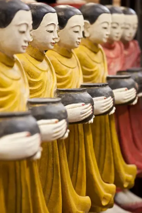 Framed Print : Row of Buddhist monk statues holding alms bowls, Weekend Market, Bangkok, Thailand