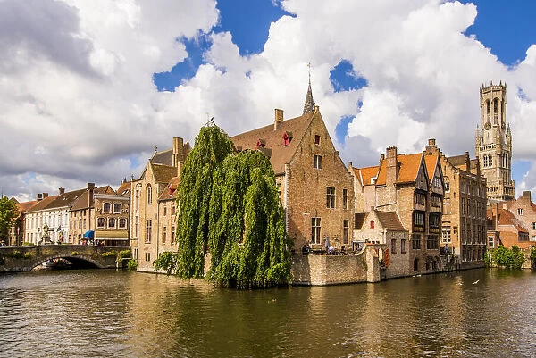 Rozenhoedkaai canal with Belfort tower, Bruges, West Flanders, Belgium