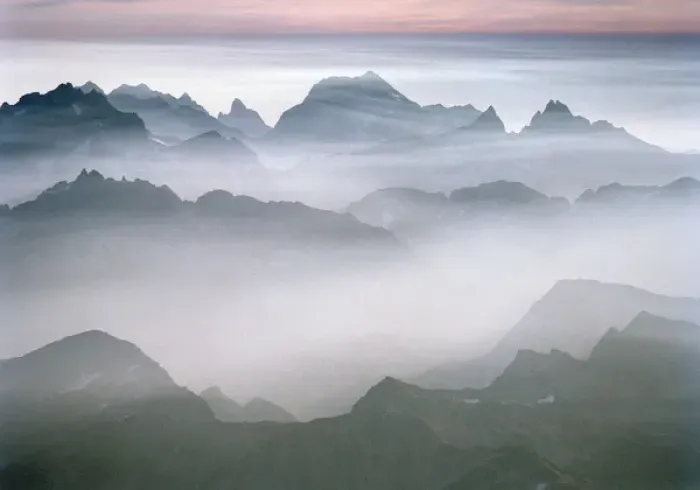 Framed Print : The rugged peaks of North Cascades National Park seen through mist with a band of Framed Print : The rugged peaks of North Cascades National Park seen through mist with a band of