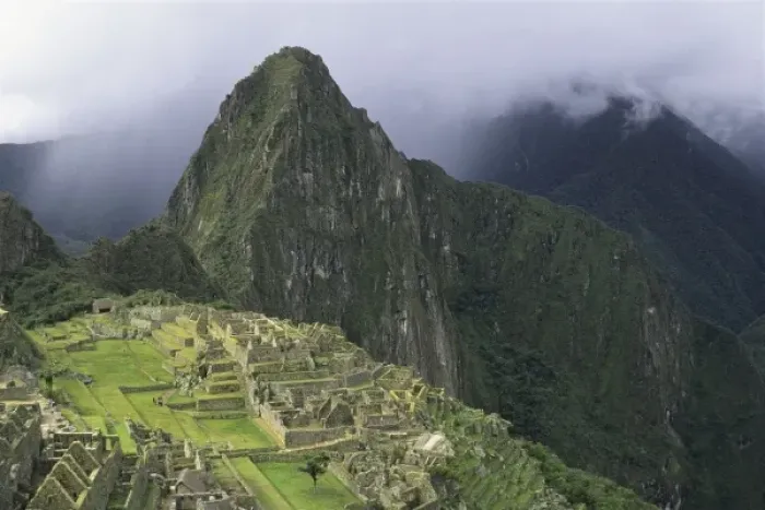 Framed Print : The ruins of the Machu Picchu citadel lie between the peak of Huayna Picchu