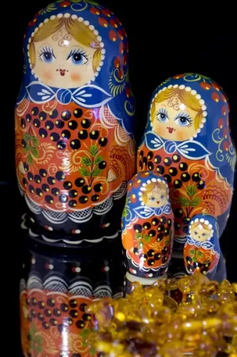 Framed Print : Russia, Russian handicrafts. Traditional painted matryoshka dolls, and amber. Property released