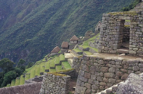 SA, Peru, Machu Picchu Stone walls and terraces of ruin high in Andes Mountains