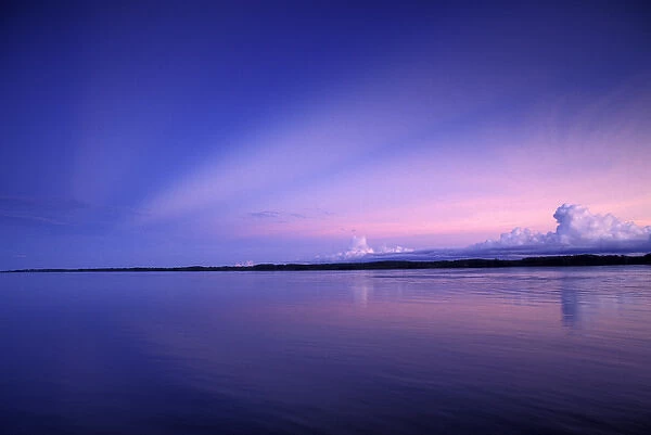 SA, Peru, Sunset over the Amazon River and the Peruvian rainforest