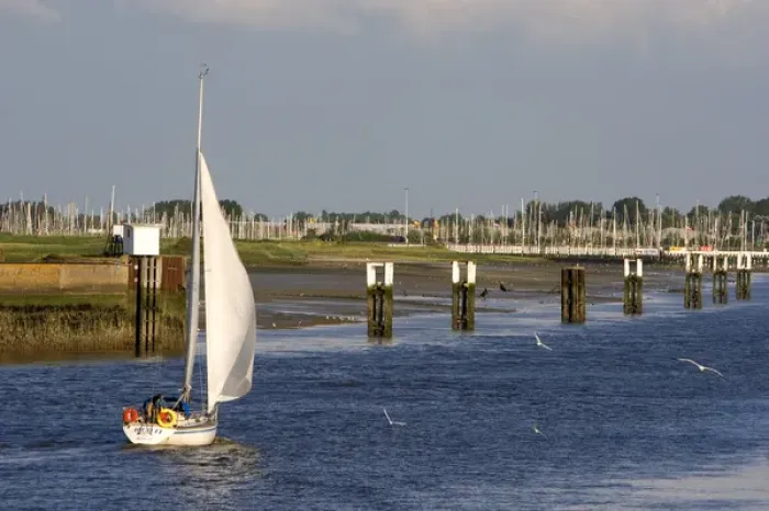 Framed Print : A sail boat at Nieuwpoort harbor entrance in the province of West Flanders, Belgium Framed Print : A sail boat at Nieuwpoort harbor entrance in the province of West Flanders, Belgium