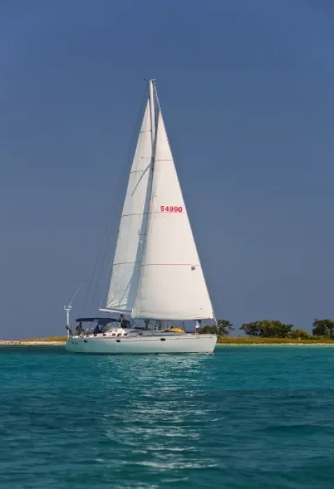 Framed Print : A sail boat sailing by Laughing Bird Cay in Belize Framed Print : A sail boat sailing by Laughing Bird Cay in Belize