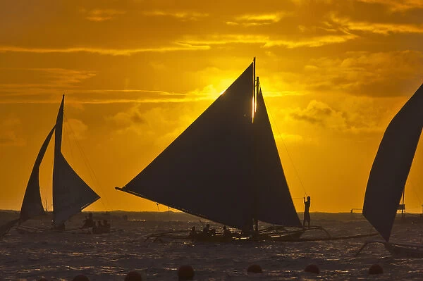 Sail boats in the ocean at sunset, Boracay Island, Aklan Province, Philippines