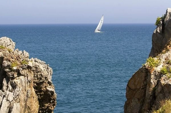 Sailboat entering the harbor at Castro Urdiales, Cantabria, northern Spain