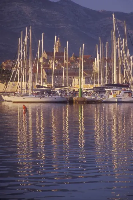 Framed Print : Sailboat masts light up in the early morning light in Korculas Eastern Harbor Framed Print : Sailboat masts light up in the early morning light in Korculas Eastern Harbor