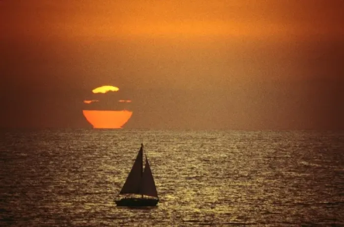 Framed Print : A sailboat at sunset in California
