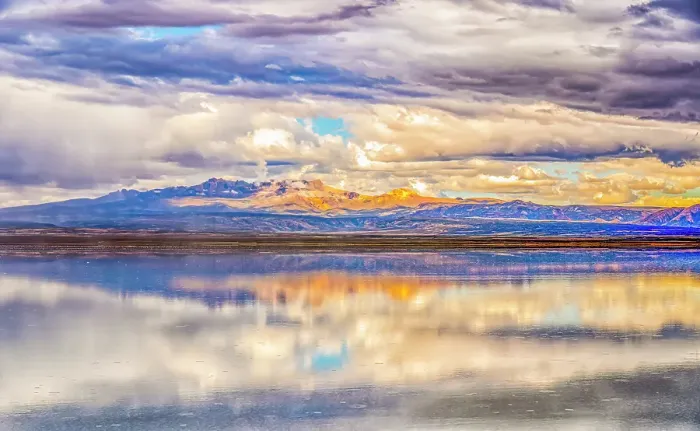 Framed Print : Salar de Uyuni, Bolivia. Wide angle landscape view of storm clouds reflected over the Salar de Uyuni, with the Andes Mountains in the distance Framed Print : Salar de Uyuni, Bolivia. Wide angle landscape view of storm clouds reflected over the Salar de Uyuni, with the Andes Mountains in the distance