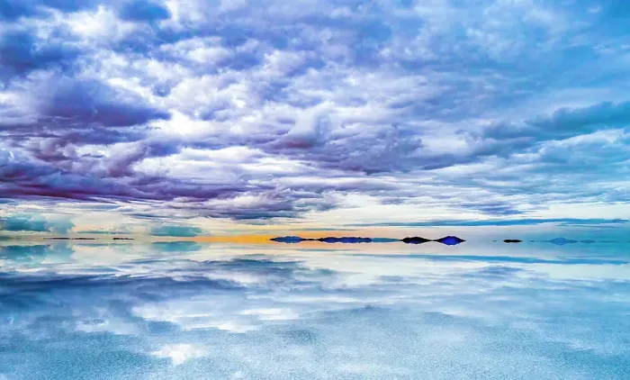 Framed Print : Salar de Uyuni, Bolivia. Wide angle landscape view at sunset of clouds hanging over the Salar de Uyuni, the world's largest salt flat Framed Print : Salar de Uyuni, Bolivia. Wide angle landscape view at sunset of clouds hanging over the Salar de Uyuni, the world's largest salt flat