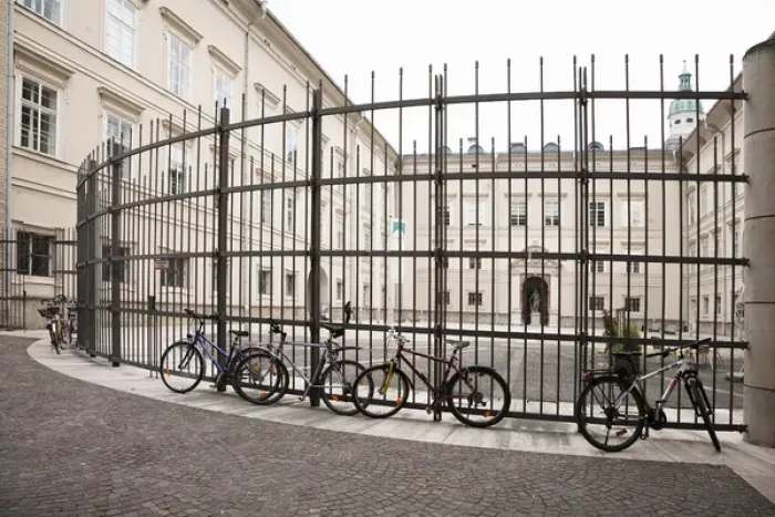 Framed Print : Salzburg, Salzburg, Austria - Bicycles parked against a tall, wrough-iron fence Framed Print : Salzburg, Salzburg, Austria - Bicycles parked against a tall, wrough-iron fence