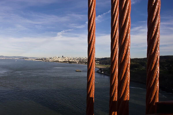 San Francisco as seen through the cables of the Golden Gate Bridge