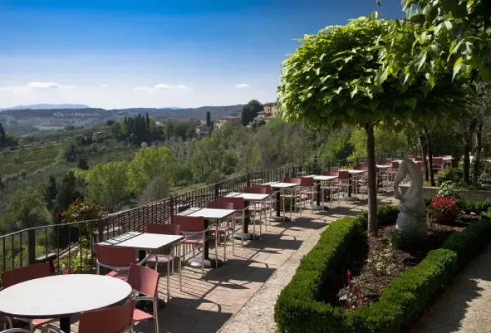 Framed Print : San Gimignano, Tuscany, Italy - High angle view of an outdoor dining terrace overlooking Framed Print : San Gimignano, Tuscany, Italy - High angle view of an outdoor dining terrace overlooking