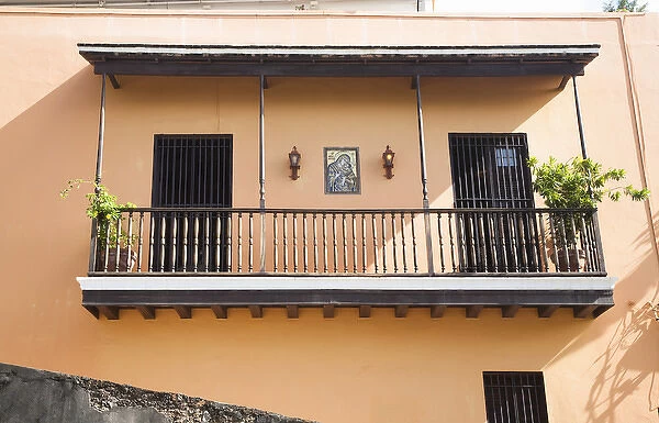 San Juan, Puerto Rico - Two doors with bars on them are set into a peach colored